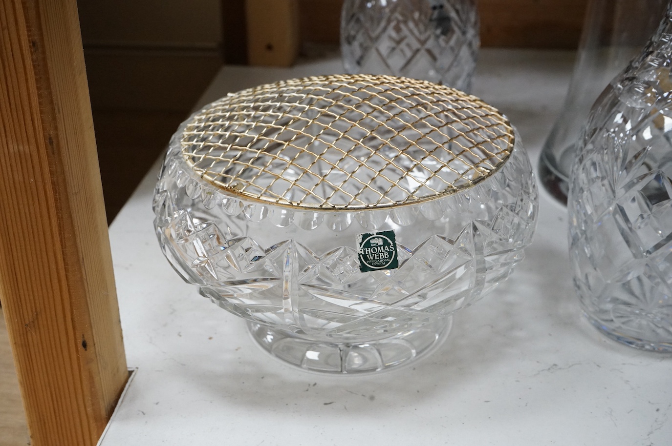 A Webb Corbett bowl, two decanters and another decanter, largest 30cm high